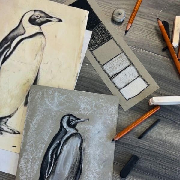 A photo of penguin artwork by a one river educator