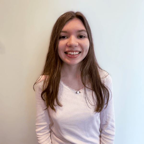 One River school student smiling against a white backdrop