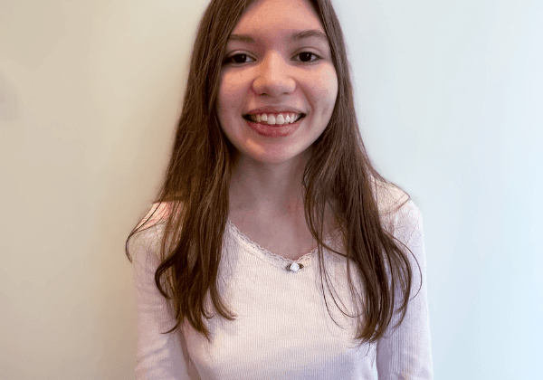One River school student smiling against a white backdrop